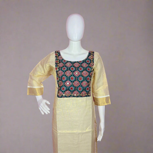 Traditional outfit with a patterned top and beige