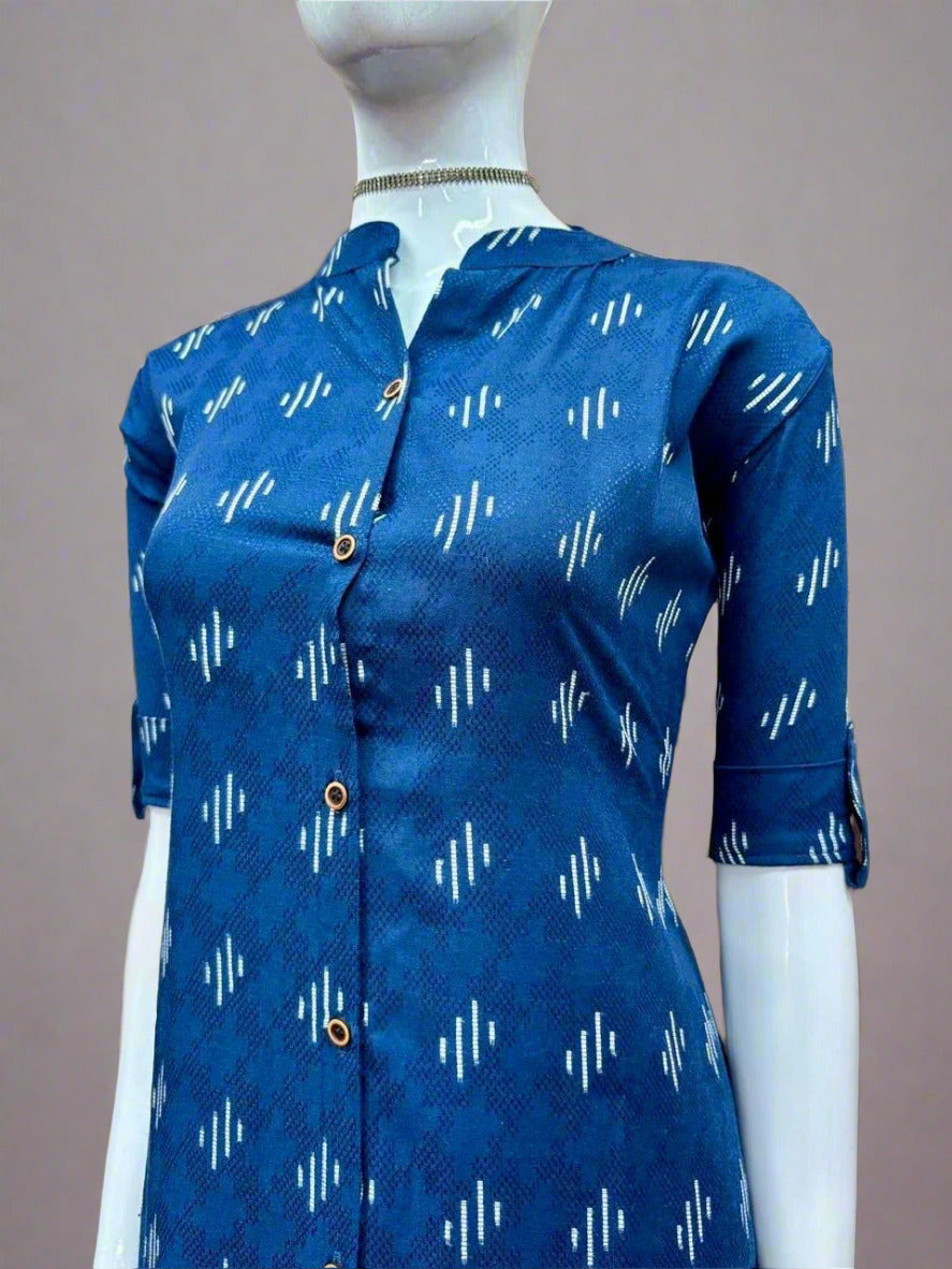 Blue patterned shirt on a mannequin against a geometric wall.