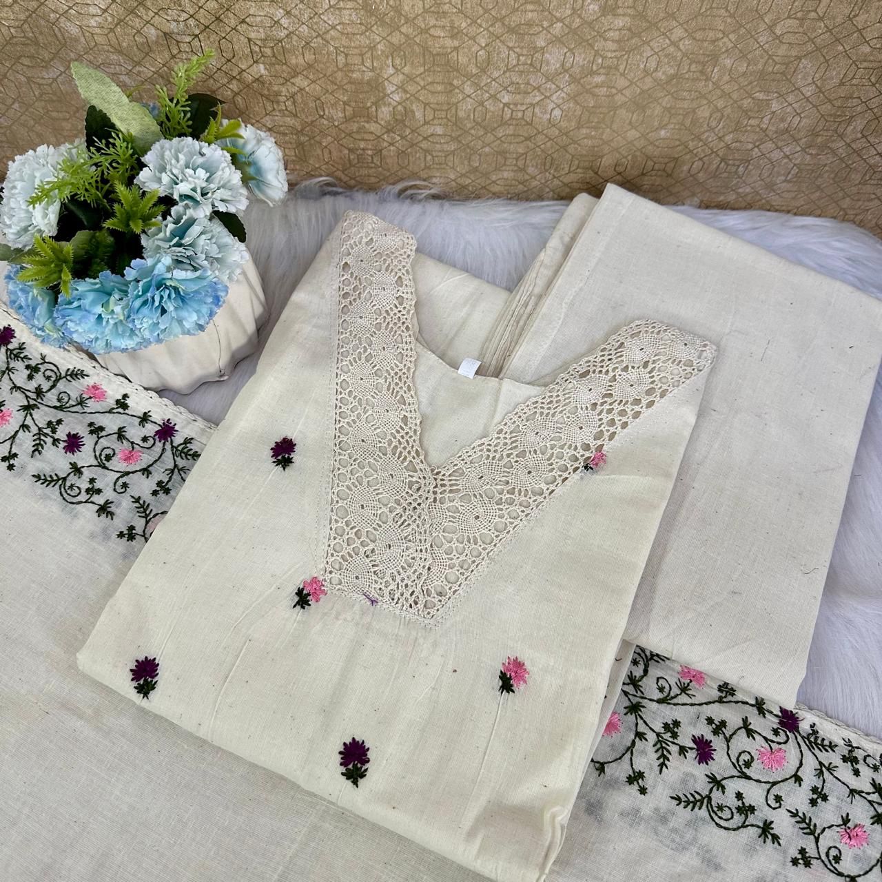 Embroidered fabric with floral patterns on a textured surface