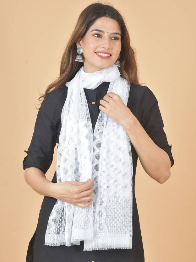 Woman wearing a white scarf with a beige background