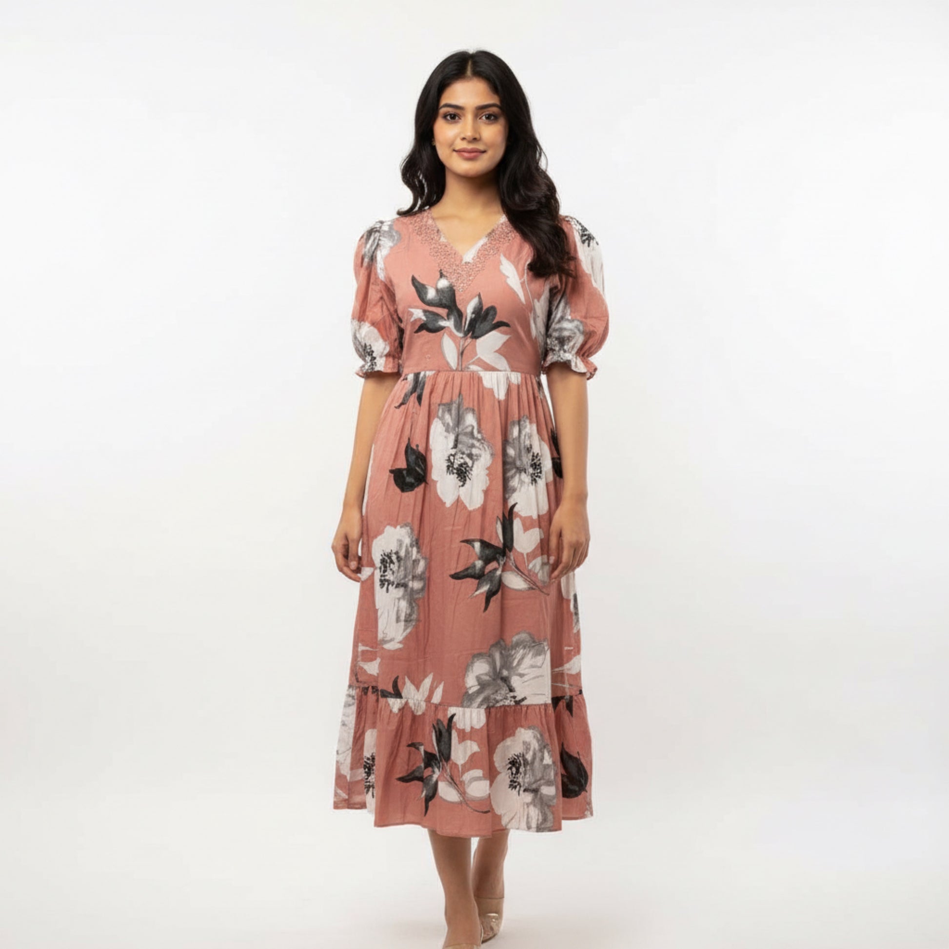 Woman wearing a floral dress on a white background