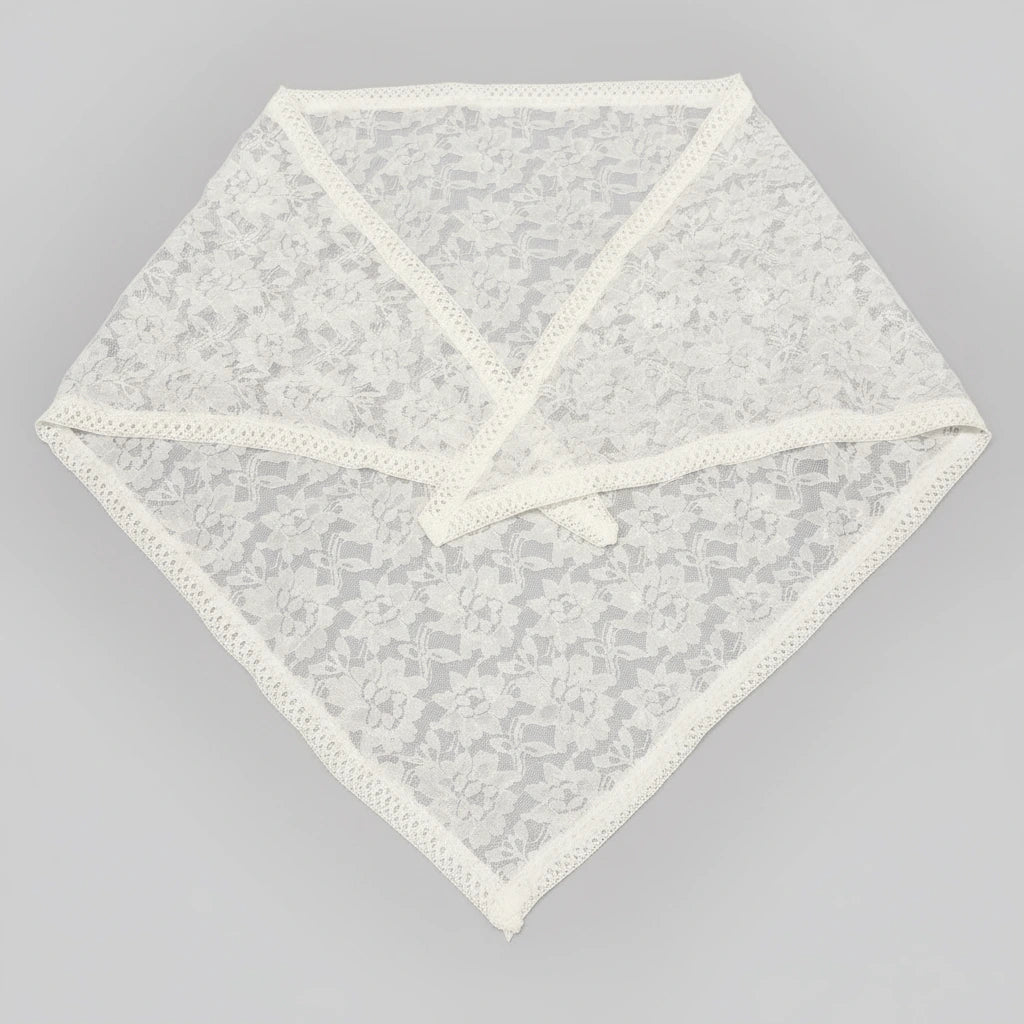 White lace doily on a gray background