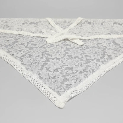 White lace underwear on a gray background