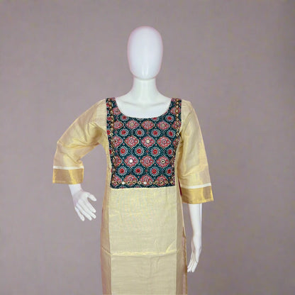 Traditional outfit with a patterned top and beige