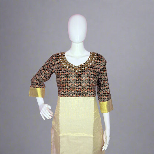 Mannequin wearing a patterned top and beige skirt 