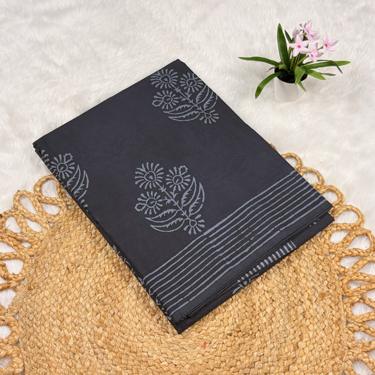 Charcoal cotton Jaipur block print saree with light grey floral buta, linear stripe borders, and matching blouse piece