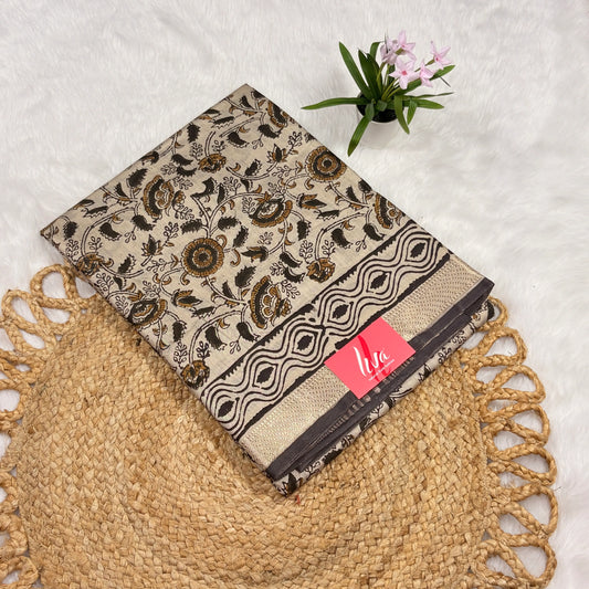 Ivory Maheshwari Bagru block print saree with black and ochre floral vines, geometric border, soft gold zari band, and matching blouse piece