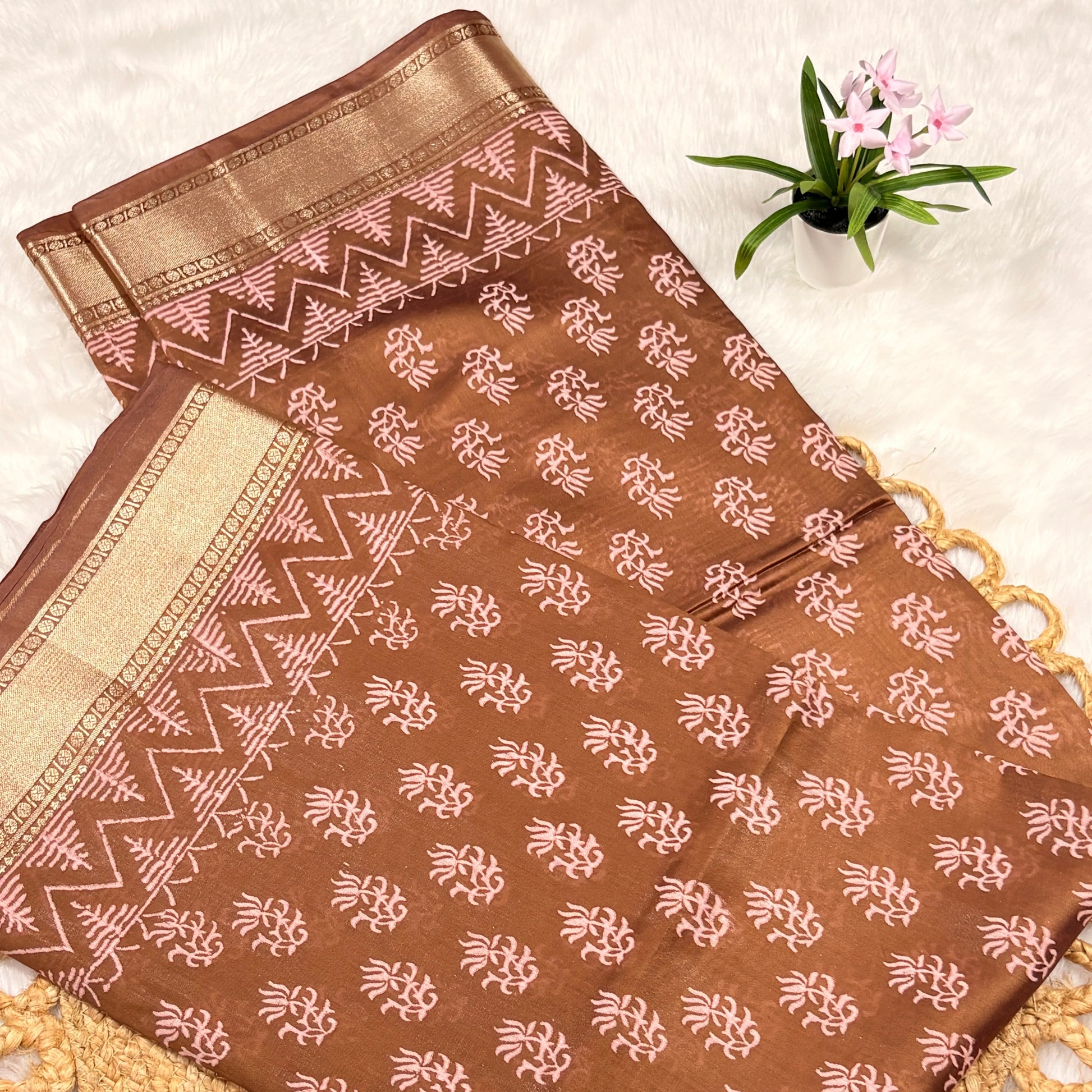 Brown fabric with white patterns on a light background