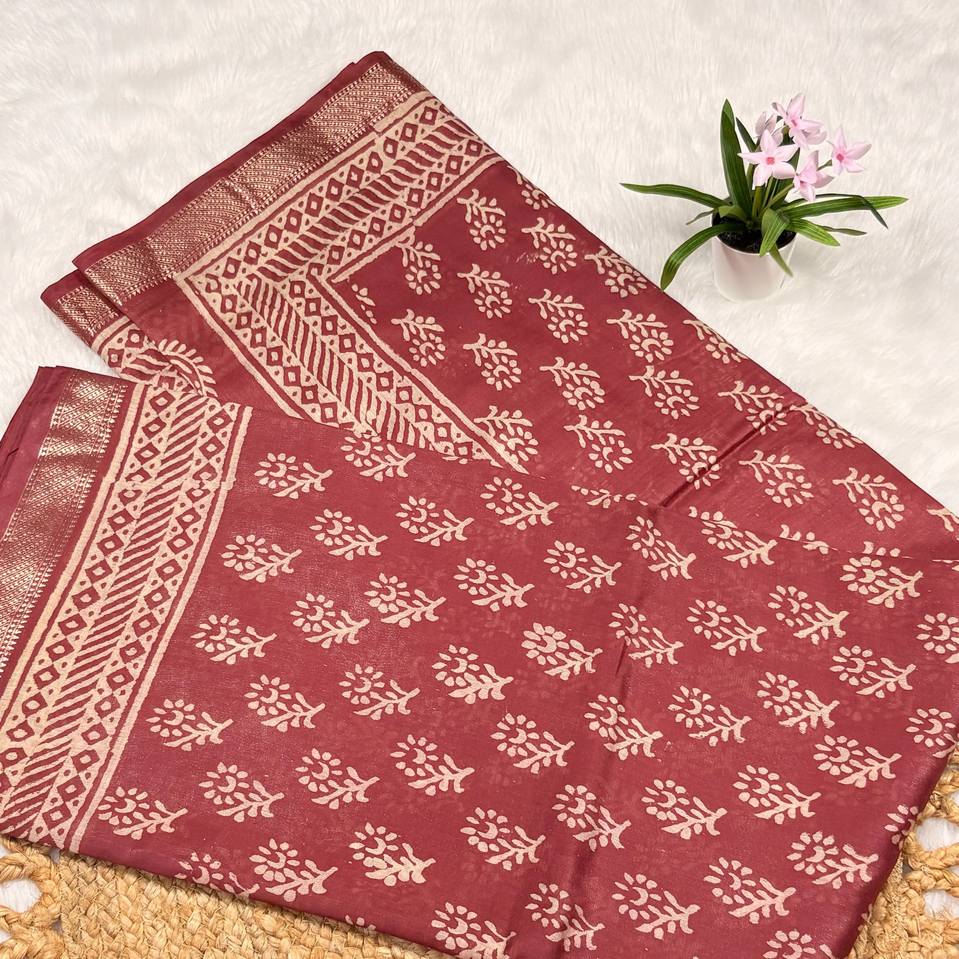 Red fabric with white patterns on a light background