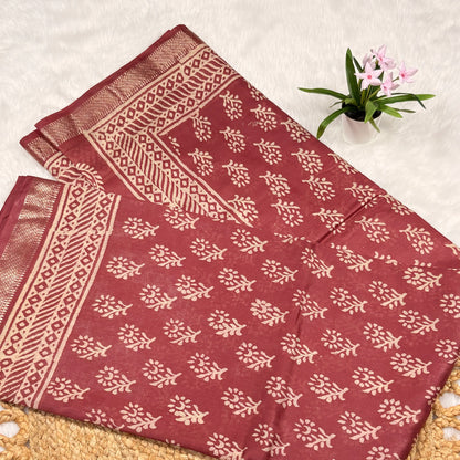 Red fabric with white patterns on a light background