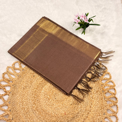 Cocoa‑brown Mangalgiri saree with fine gold jari checks, rich gold pallu, tasselled edge, and matching blouse piece, folded on a natural mat