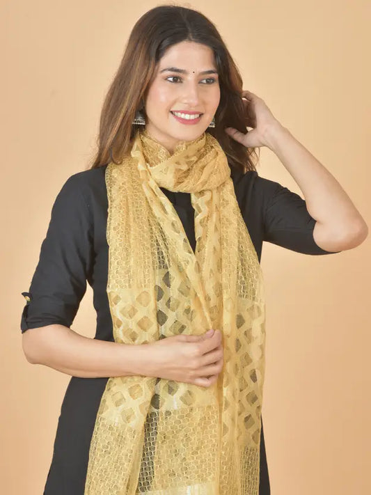 Woman wearing a yellow scarf against a beige background