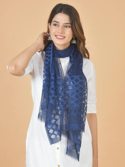 Woman wearing a blue scarf on a beige background