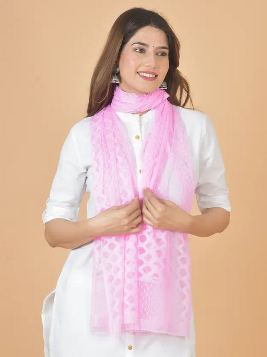 Woman wearing a pink scarf on a beige background