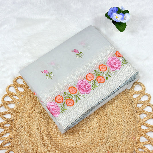 Embroidered fabric with floral patterns on a textured surface