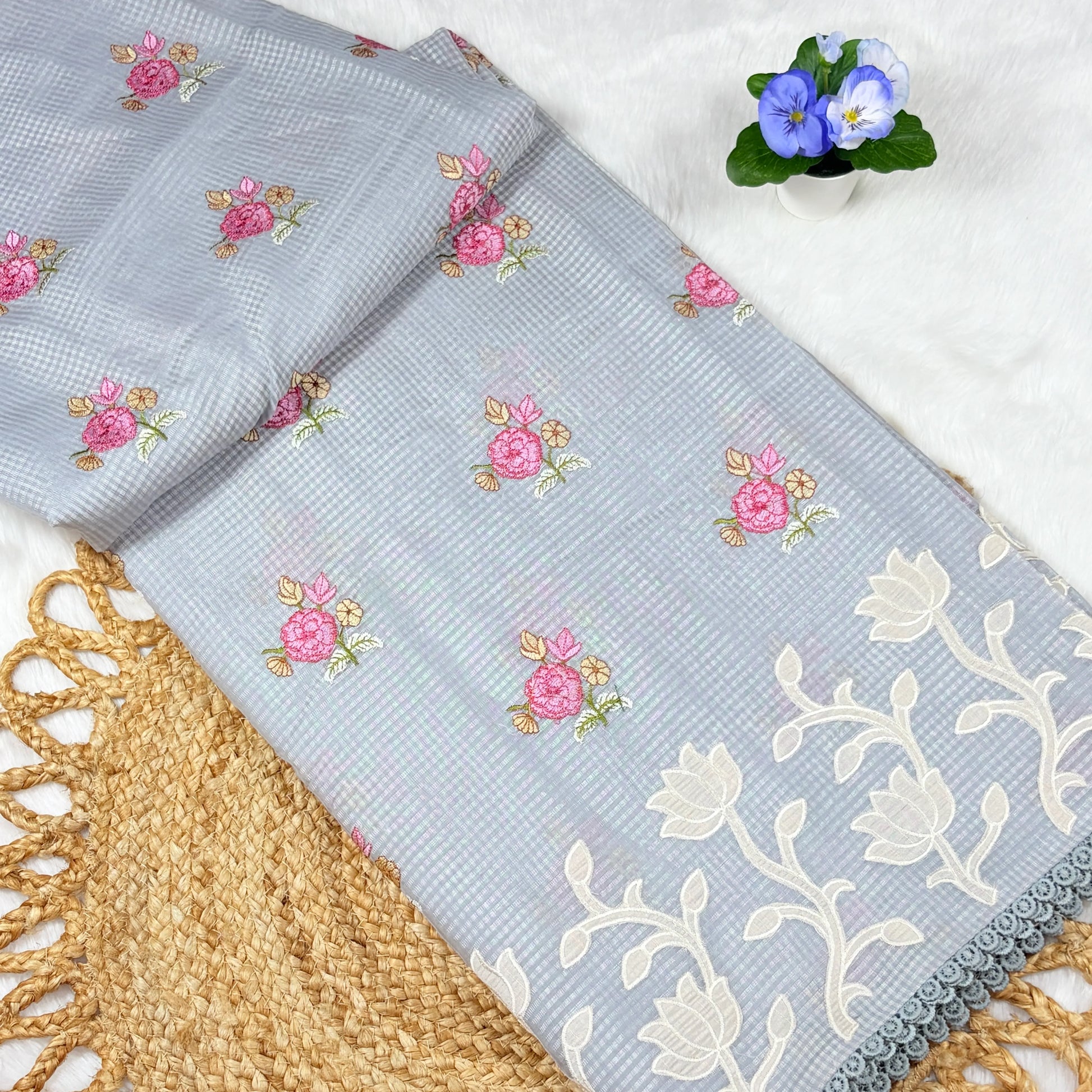 Floral-patterned fabric with embroidery on a white background
