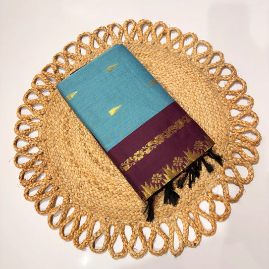 Textile with blue and purple design on a woven placemat