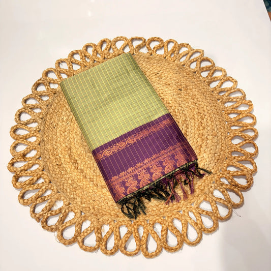Green and purple woven fabric on a decorative woven placemat
