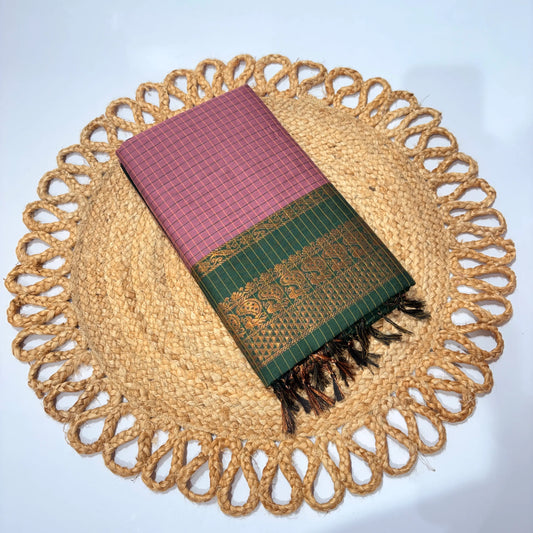 Folded fabric with pink and green patterns on a woven placemat