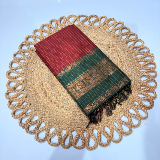 Red and green patterned fabric on a woven mat with a blue background
