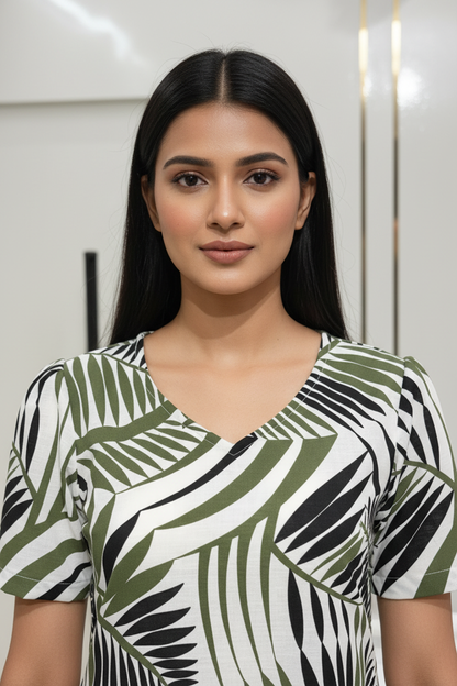 Close-up detail of olive green black tropical leaf print cotton kurti V-neck and puff sleeve design