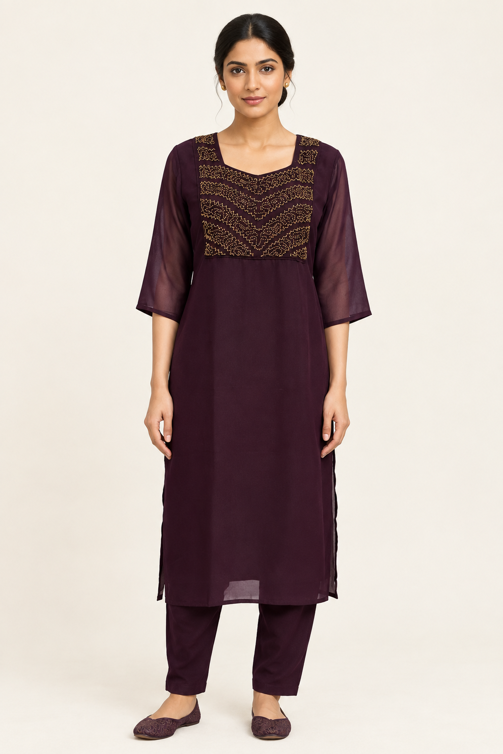 Indian model in dark plum kurta set with gold-toned handworked yoke, matching straight pants and sheer sleeves