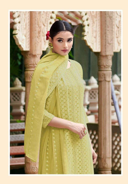 Lime‑yellow heavy Schiffli georgette kurti set with straight silhouette, round neck, 3/4 sleeves, crepe bottom with payal work, and matching georgette Schiffli dupatta